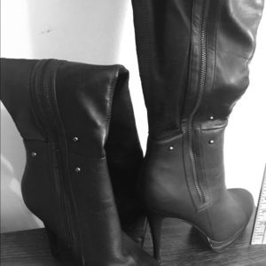 Women’s size 10, 4’ Thigh-high Black Boots.